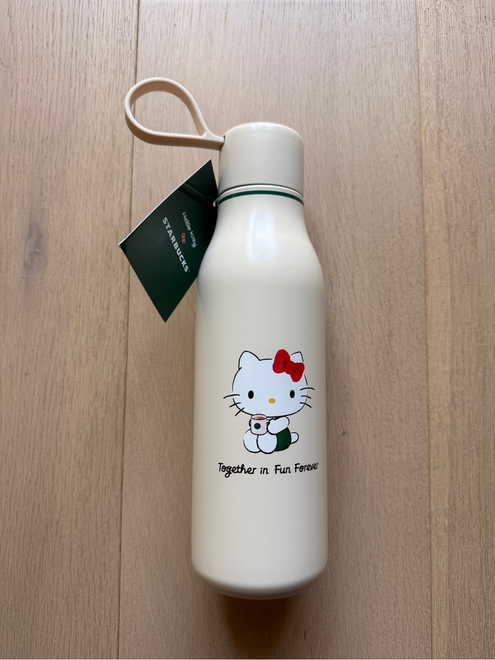 Hello Kitty x Starbucks Collab Cream Bottle with Red Bow and Green Tag